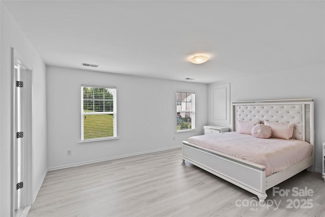 bedroom with light hardwood / wood-style floors