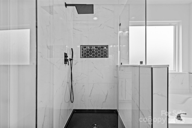 bathroom with tiled shower