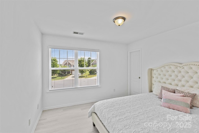 bedroom with light hardwood / wood-style floors