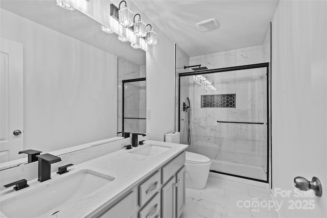 bathroom featuring vanity, a chandelier, toilet, and walk in shower