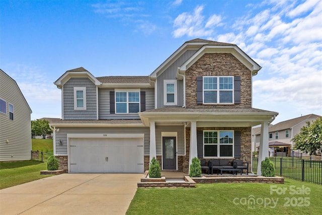 craftsman house featuring a garage, covered porch, and a front lawn