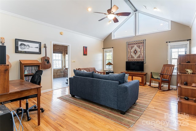 living room featuring a ceiling fan, baseboards, ornamental molding, and light wood finished floors