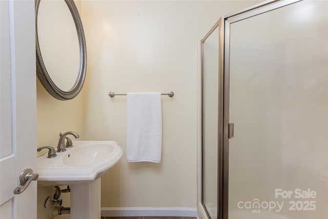 full bathroom featuring a shower stall