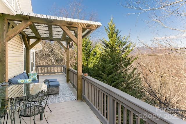 wooden deck featuring an outdoor living space