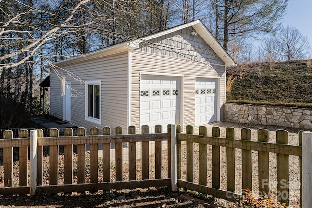 detached garage with fence