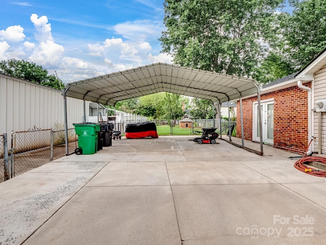 view of parking featuring a carport and fence