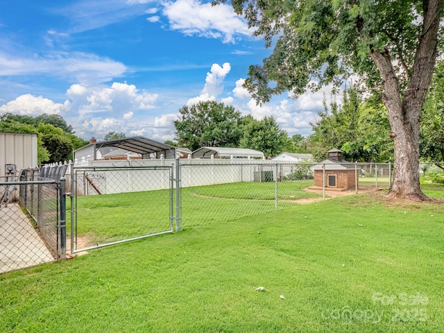 view of yard featuring a gate and fence