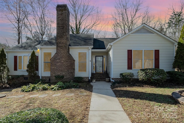 view of front of home with a chimney