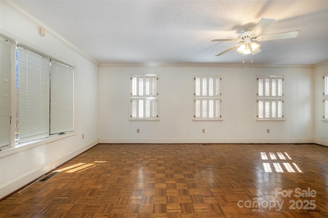 empty room featuring ceiling fan, crown molding, dark parquet floors, and a textured ceiling