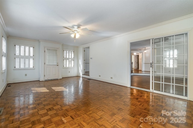 interior space featuring crown molding, ceiling fan, and dark parquet flooring