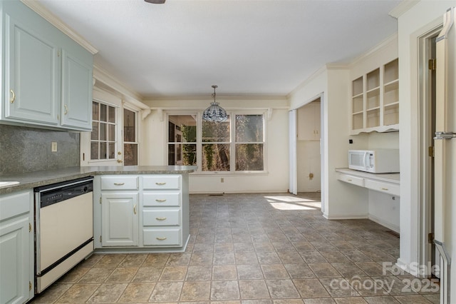 kitchen featuring tasteful backsplash, built in desk, white appliances, pendant lighting, and crown molding