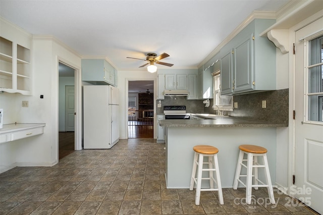 kitchen featuring kitchen peninsula, white refrigerator, black electric range oven, sink, and ceiling fan