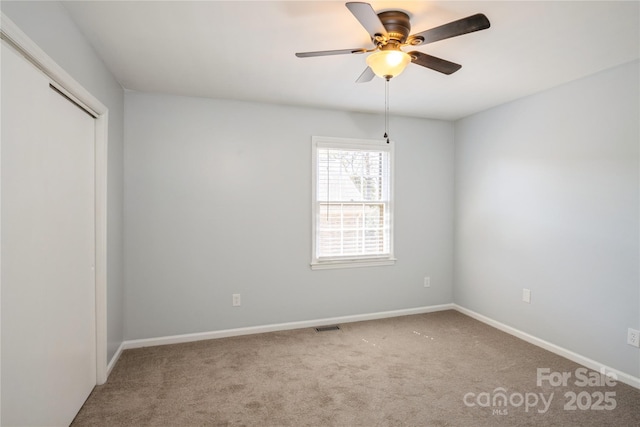 6322 Old Pineville Rd Unit E, Charlotte, NC 28217 - spare room with baseboards, visible vents, carpet floors, and a ceiling fan