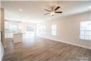 616 Smith St Unit A, Mooresville, NC 28115 - unfurnished living room with dark hardwood / wood-style floors and ceiling fan