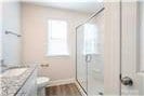 616 Smith St Unit A, Mooresville, NC 28115 - bathroom with vanity and a shower with door