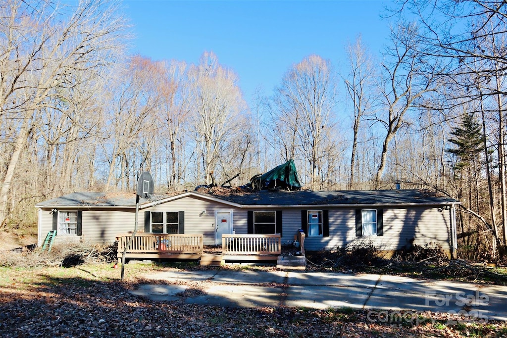 ranch-style house with a deck