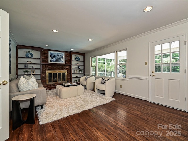 3600 Carmel Rd, Charlotte, NC 28226 - living room featuring ornamental molding, dark wood finished floors, recessed lighting, a fireplace, and built in features