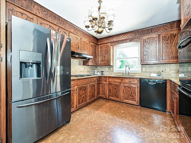 3600 Carmel Rd, Charlotte, NC 28226 - kitchen with stainless steel refrigerator with ice dispenser, black dishwasher, a sink, under cabinet range hood, and a chandelier