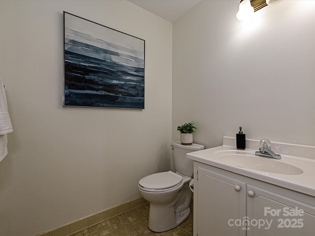 3600 Carmel Rd, Charlotte, NC 28226 - bathroom with vanity, toilet, and baseboards