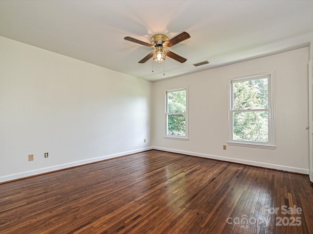 3600 Carmel Rd, Charlotte, NC 28226 - spare room featuring dark wood-style flooring, a ceiling fan, and baseboards