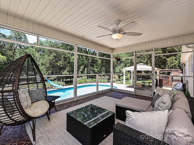 3600 Carmel Rd, Charlotte, NC 28226 - outdoor pool featuring an outdoor hangout area, a water slide, ceiling fan, and view of scattered trees