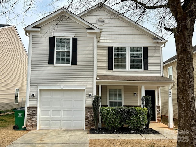 view of front of house with stone siding, an attached garage, and concrete driveway