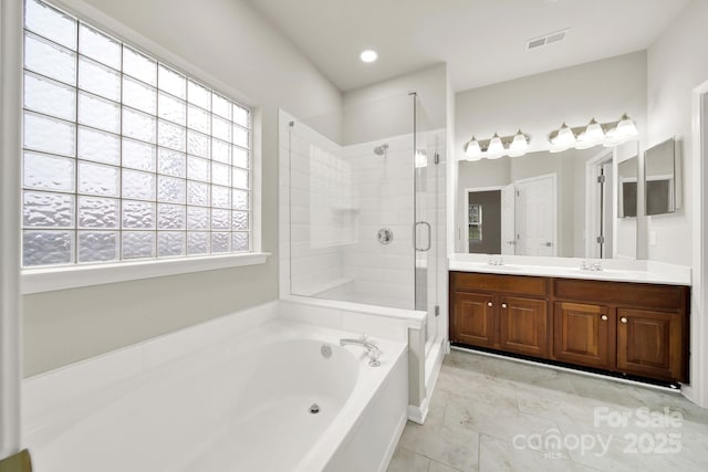 full bath featuring visible vents, a shower stall, double vanity, a bath, and a sink