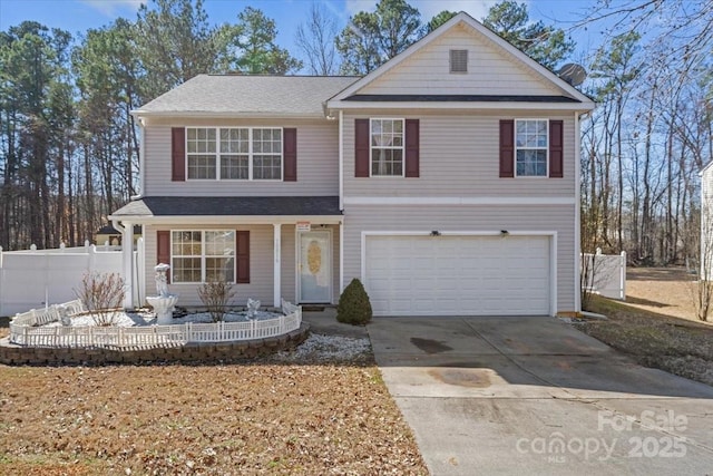 traditional-style home with driveway, a garage, fence, and roof with shingles