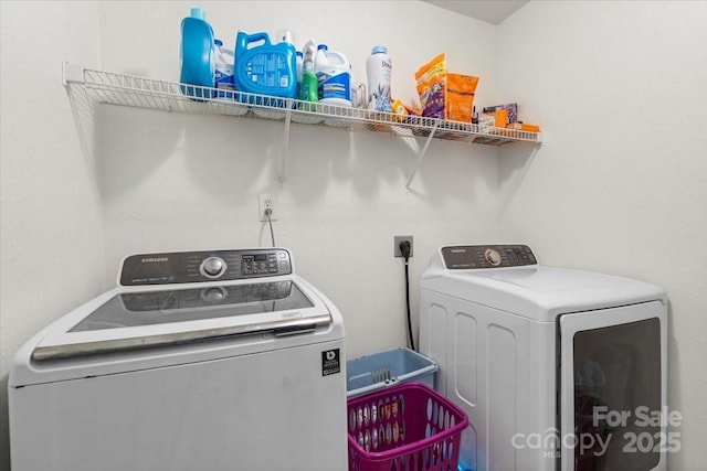 laundry room featuring washer and dryer and laundry area