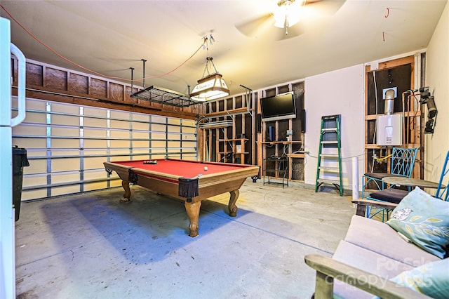 playroom with a garage, billiards, ceiling fan, and concrete flooring