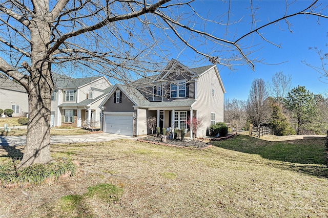 view of front facade with an attached garage, concrete driveway, and a front yard