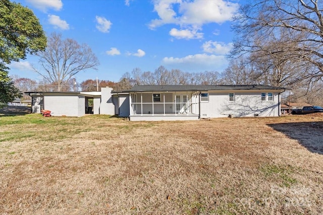 view of front of home with a sunroom and a front yard