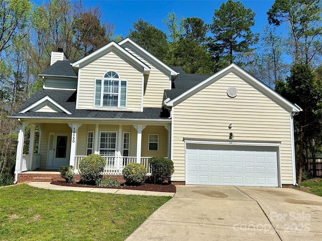 traditional home with driveway, a front yard, covered porch, an attached garage, and a shingled roof