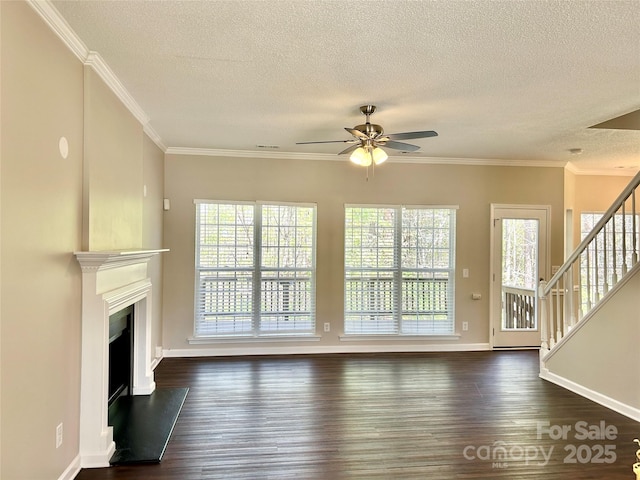 unfurnished living room with dark wood finished floors, crown molding, stairway, and ceiling fan