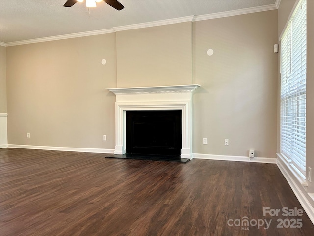 unfurnished living room with dark wood-style flooring, crown molding, and a ceiling fan