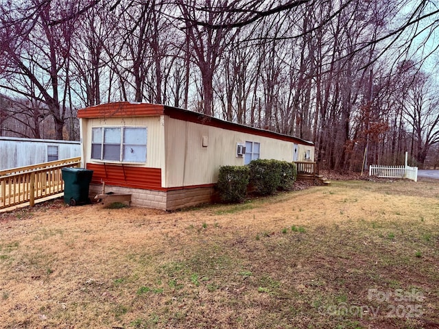 view of property exterior with a lawn