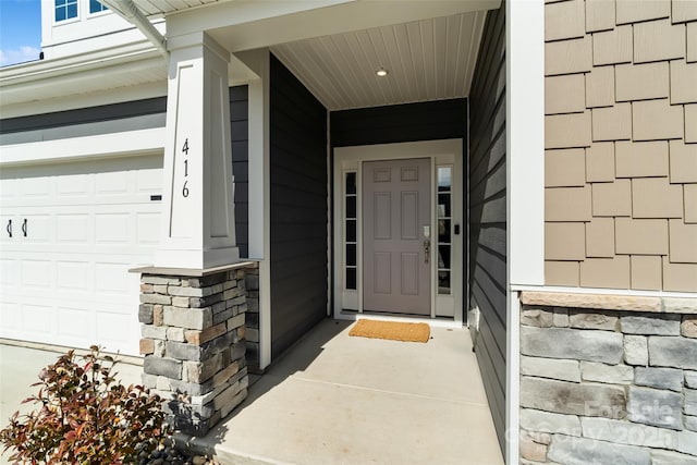 view of exterior entry with stone siding