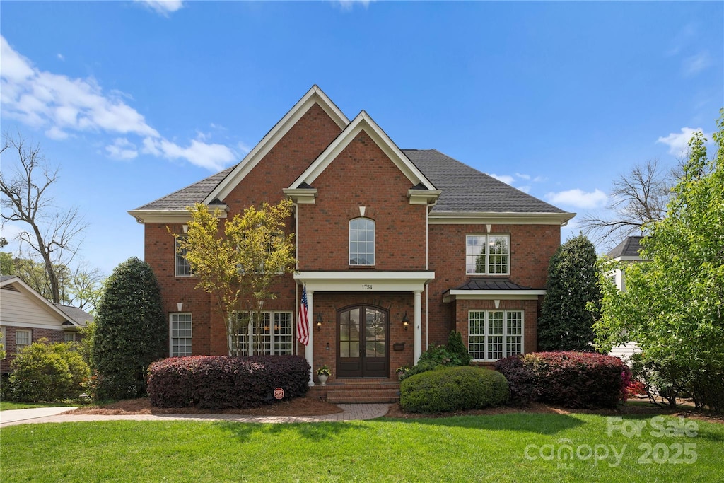 1754 Sterling Rd, Charlotte, NC 28209 - view of front of house featuring french doors, a front yard, and brick siding