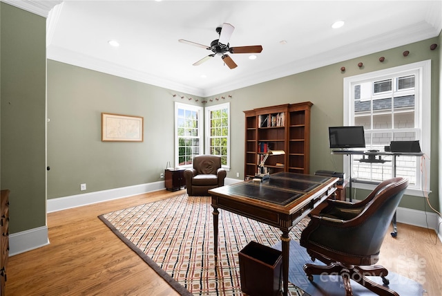 office space featuring baseboards, ornamental molding, and wood finished floors