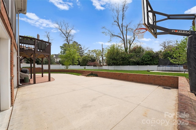 view of patio / terrace with a trampoline and a fenced backyard