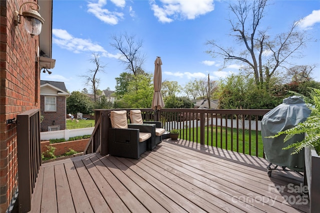 wooden terrace with a lawn