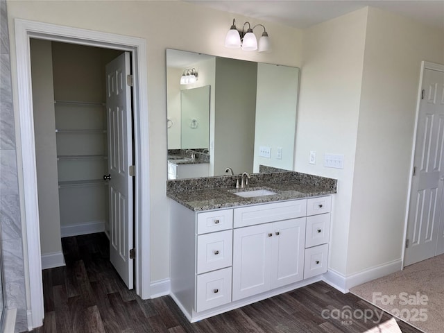 bathroom featuring hardwood / wood-style flooring and vanity