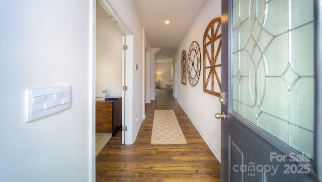 hallway with dark hardwood / wood-style floors