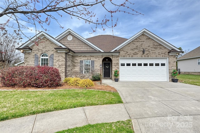 single story home featuring concrete driveway, an attached garage, brick siding, and a front yard