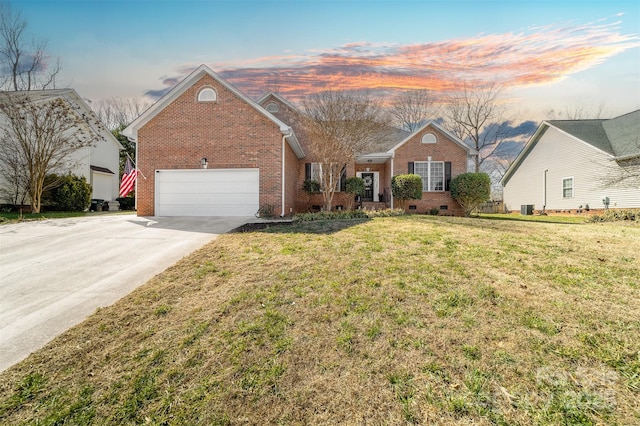 view of front facade featuring a front lawn, crawl space, brick siding, and concrete driveway