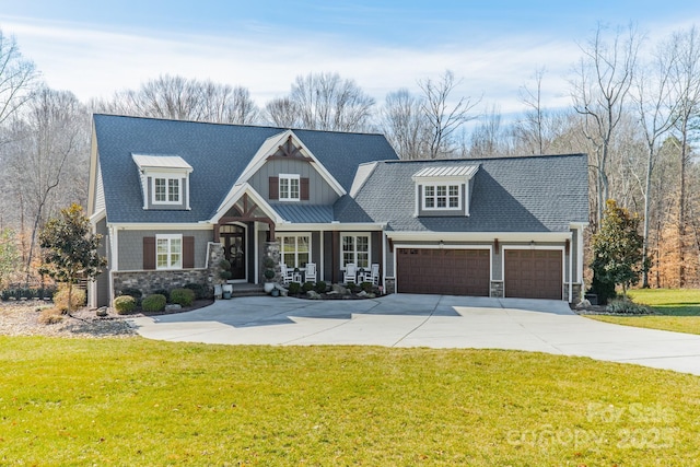 view of front of property with a garage and a front lawn