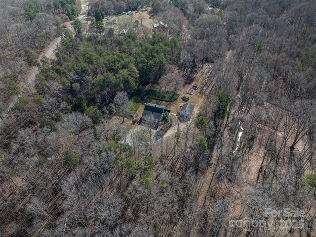 aerial view with a wooded view