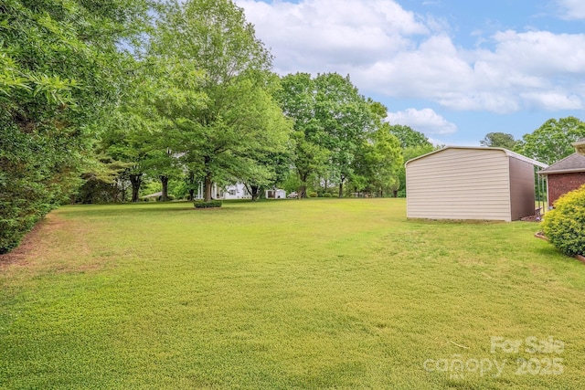 119 Era St, Troutman, NC 28166 - view of green lawn featuring an outbuilding