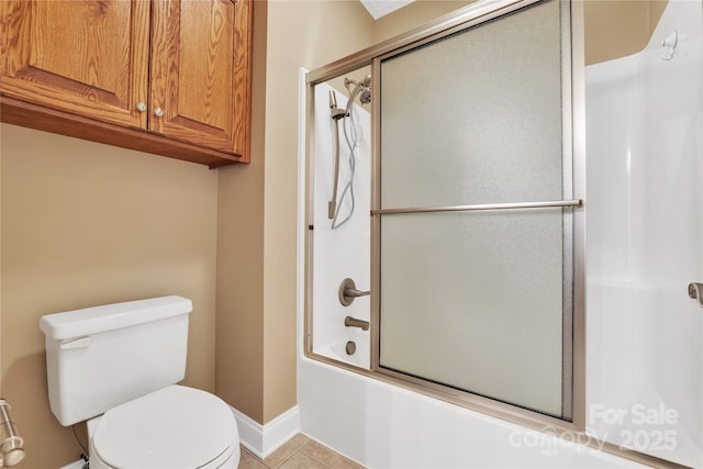 119 Era St, Troutman, NC 28166 - full bath featuring toilet, tile patterned floors, shower / bath combination with glass door, and baseboards