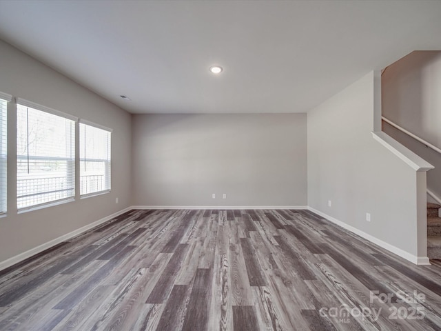 unfurnished living room featuring hardwood / wood-style flooring